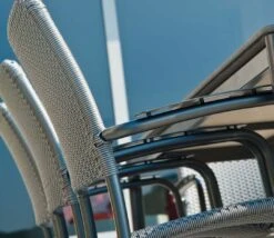 Alexander Rose Portofino Stacking Woven Armchair -Love Garden a side view of the elegant woven chair b879b1968f1203de953b143b058b696c original