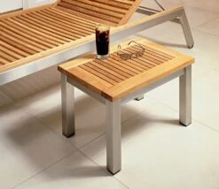 Barlow Tyrie Equinox Sun Teak Lounger Side Table -Love Garden the teak sun lounger side table in use. 7e85e0203905e2d48795ffb65dd84de6 original